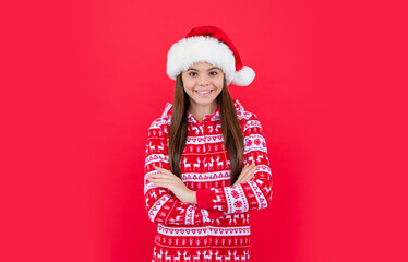 happy new year. smiling teen girl in red new year santa claus hat in studio. santa new year girl