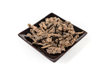 Valerian roots in a black ceramic tray diagonal view