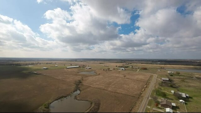 Aerial of farmland, plains, and a ranch in Texas.