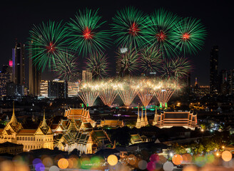 Top view of the Grand Palace and The Emerald Buddha Temple, Chakri Maha Prasat Throne Hall in new year fireworks and projection mapping during the Vijit Chao Phraya festival performance.
