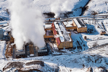 Aerial view to geothermal power plant in mountain. Clean green renewable energy in Kamchatka. - 551028810