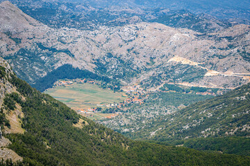 Naklejka na ściany i meble Aerial view of village in mountains, Montenegro