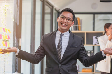Fototapeta premium Marketing, Financial, Accounting, and Planning, a businessman expresses his joy at making annual profits for a successful company.