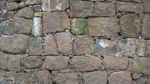 August 2022 - Barichara to Guane pilgrimage - Colombia South America - walls made with cooked dry earth and stones according to the ancient tradition of the natives -  tree goes through the wall