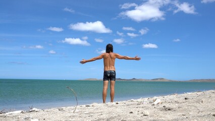 40 years old man arrives to the beach in the Caribbean sea ocean - relax physical and mental...