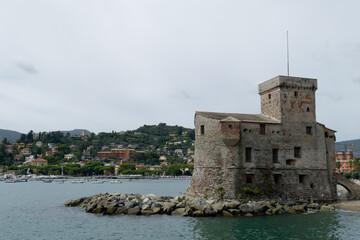 Fototapeta na wymiar View of the Rapallo castle from the bay on the Tigullio gulf . Liguria, Italy