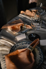 Modern wedding decoration. A beautifully decorated table for a festive celebration. Blur effect.