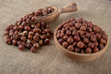 View of a bowl full of hazelnuts on burlap sack
