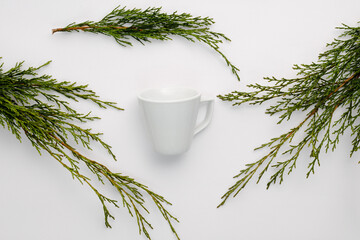 coffee cup with pine branches