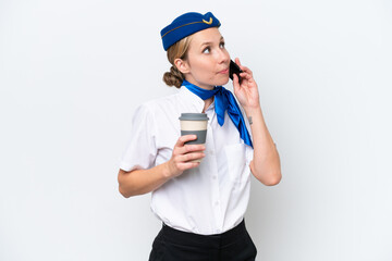 Airplane blonde stewardess woman isolated on white background holding coffee to take away and a mobile