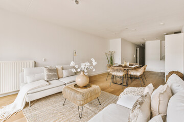 Contemporary minimalist style interior design of light studio apartment with wooden table and...