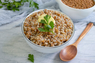 Boiled buckwheat porridge on old background