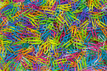 Fototapeta na wymiar Bright colorful paper clips.top view