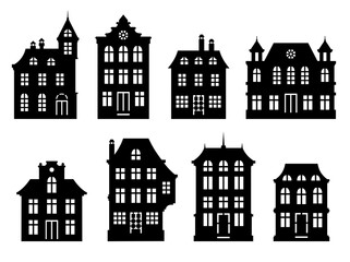 Fototapeta premium Vector monochrome houses set. Black old style ornate houses with white windows and doors. Template for paper cutting, laser cutting.