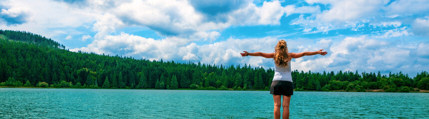 woman traveling in Auvergne- lake and forest