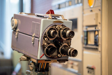 Old fashioned tv production equipment. Big video camcorder on tripod. Media and television concept.