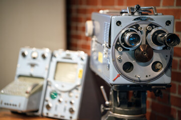 Old fashioned tv production equipment. Big video camcorder on tripod. Media and television concept.