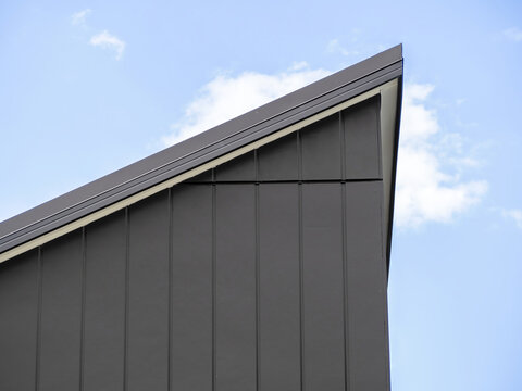 Skillion roof upper ridge with blue sky background