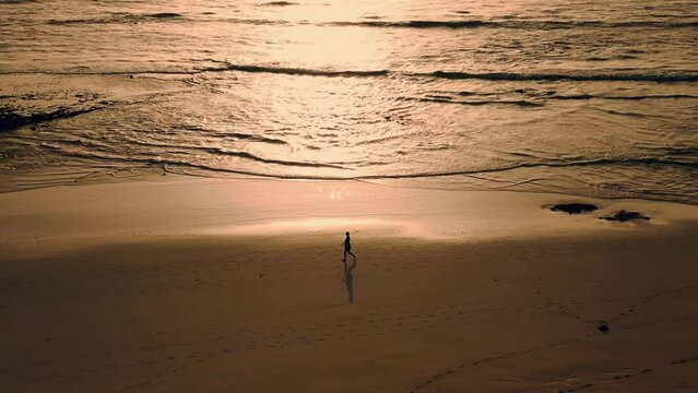 aerial clip of an early morning walk along Flag Beach, Grandes Playa, Corralejo, Fuerteventura