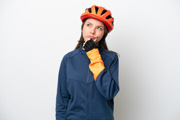 Young cyclist Lithuanian woman isolated on white background having doubts
