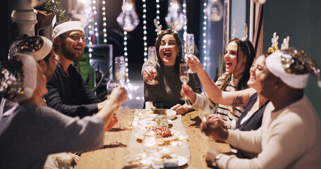Christmas, party and friends toast with champagne at dinner, lunch and festival celebration...