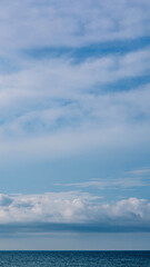 BANNER, VERTICAL STORY Atmosphere panorama white cloud clear blue sky horizon line calm empty sea. Concept paradise life. Design relax wallpaper background. More tone format in stock