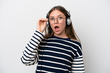 Telemarketer caucasian woman working with a headset isolated on white background with glasses and surprised