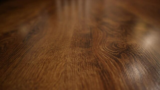 close-up texture of wooden parquet with natural pattern. Video partially out of focus