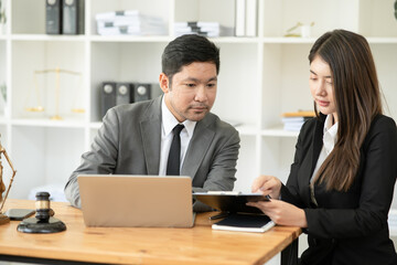 Obraz premium Lawyers having Concepts of Legal services at the law office work Legal advice online on computer labor law