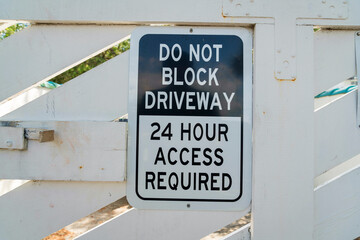 Destin, Florida- Close-up of a sign with Do Not Block Driveway 24 Hour Access Required