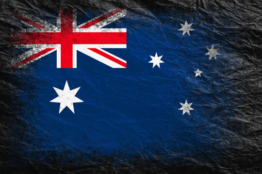 Flag of Australia. Flag is painted on black crumpled paper. Paper background. Copy space. Textured background