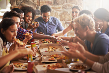 Pizza, dinner party and friends at a restaurant together feeling happy about social celebration. Diversity, food and lens flare of people eating fast food at dinner talking and speaking at a table - obrazy, fototapety, plakaty