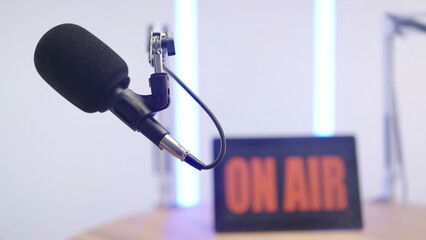 On Air Podcast Studio Microphone close-up with Neon lights in background