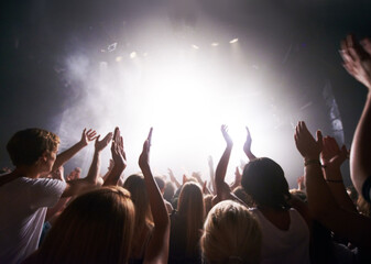 Concert, live music and people dancing at an event, party or nightclub with energy, freedom and...