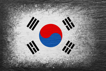 Flag of South Korea. Flag is painted on black slate stone. Stone background. Copy space. Textured...