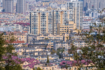 Naklejka premium Aerial photography of red roofs and streets of European-style, close up on residential buildings