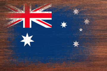 Flag of Australia. Flag is painted on a wooden surface. Wooden background. Plywood surface. Copy space. Textured background