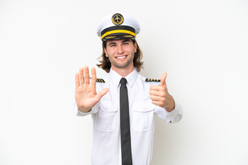 handsome Airplane pilot isolated on white background counting six with fingers