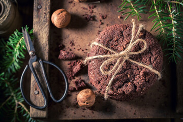 Sweet and brown chocolate cookies with spruce and nuts.