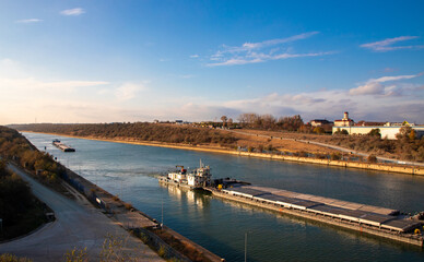Landscape with cargo ships on the Danube - Black Sea canal - Romania 