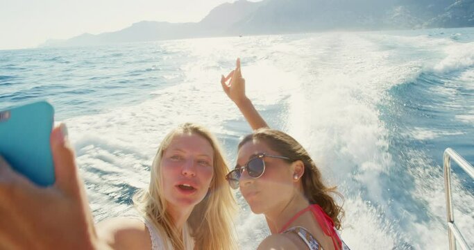 Yacht, phone or friends at a beach take selfie for travel blog, girls trip or freedom on holiday vacation in Italy. Influencer, content creator or happy women taking boat pictures for social media