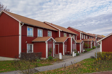 Image of Typical scandinavian style street with red wooden apartment houses