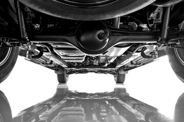 Rear view of suspension car, chassis, spare tire, axle on black and white color. - obrazy, fototapety, plakaty