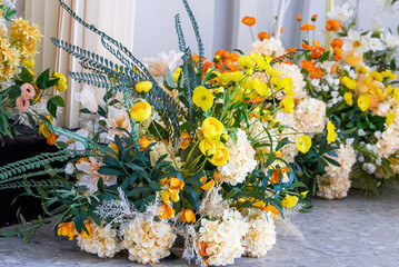 Close-up of various fake flowers placed at wedding scene