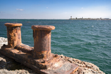 Fototapeta na wymiar Lighthouse and old pier on Donuzlav lake. Crimea