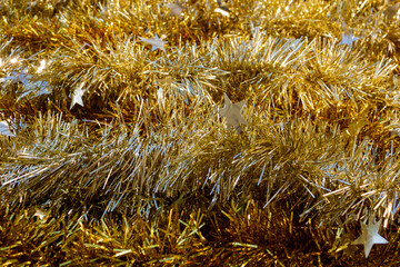 Yellow gold Christmas tinsel texture background