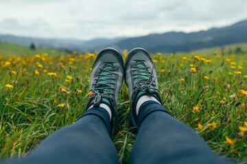 Girl hiking boots having fun and enjoying wonderful breathtaking mountain view. Freedom concept....