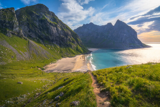 hiking mount ryten and kvalvika beach on lofoten islands in norway