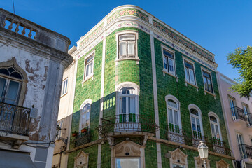 Obraz premium Green house tiled building in Luis de Camoes square in the historic center of Lagos city town in Algarve, Portugal.