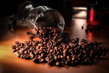 freshly roasted coffee beans for coffee on a coffee machine in a coffee shop on a wooden background
